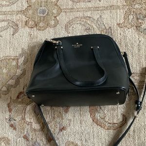 Black Kate Spade purse with gold detailing